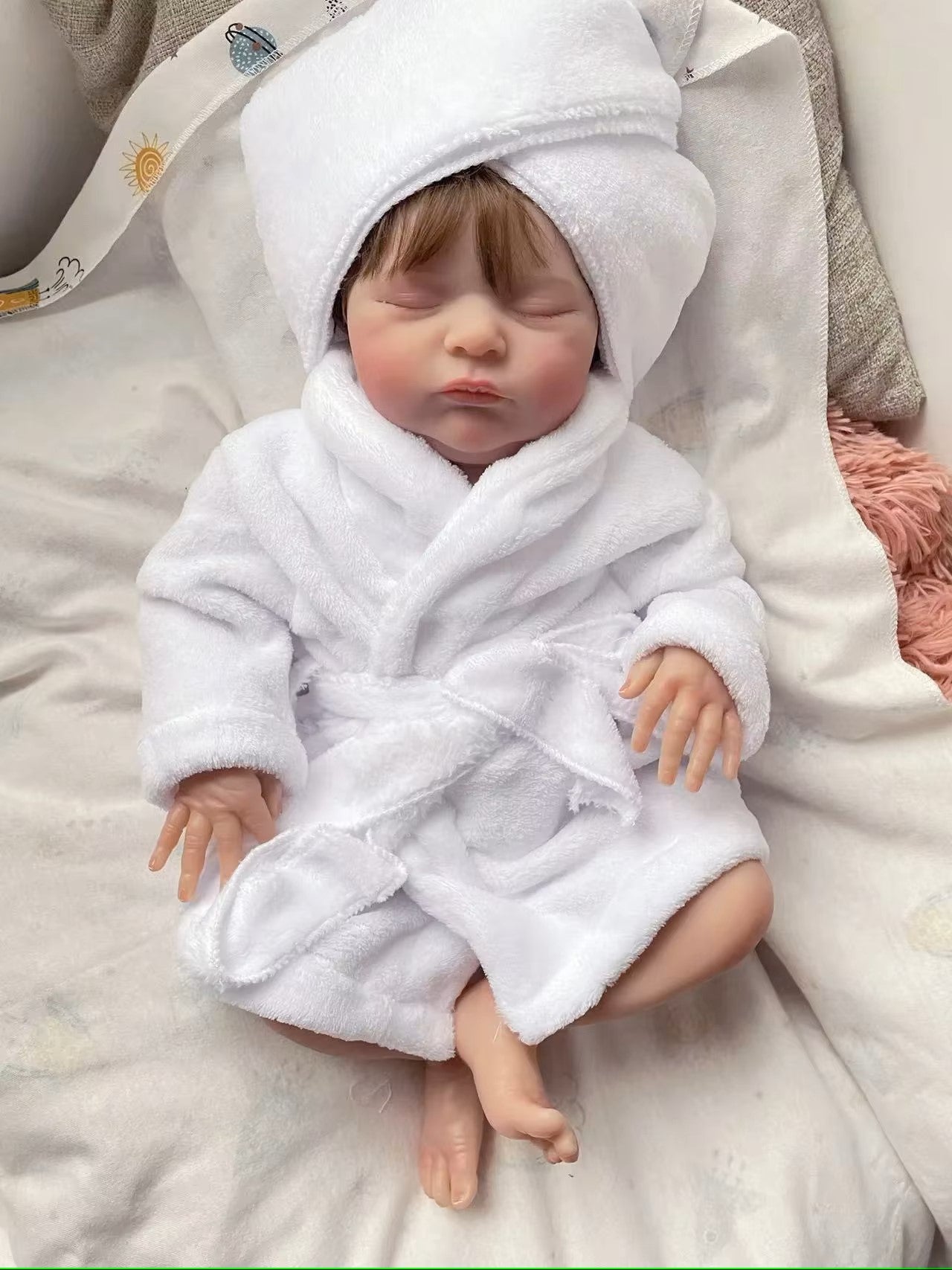 reborn baby doll in bathrob